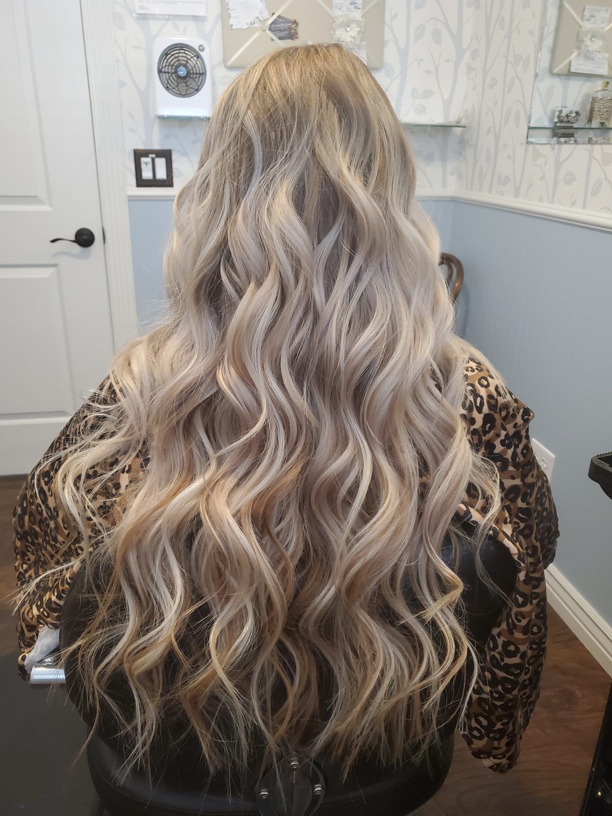 Long icy ash-blonde beach waves, shown from behind.