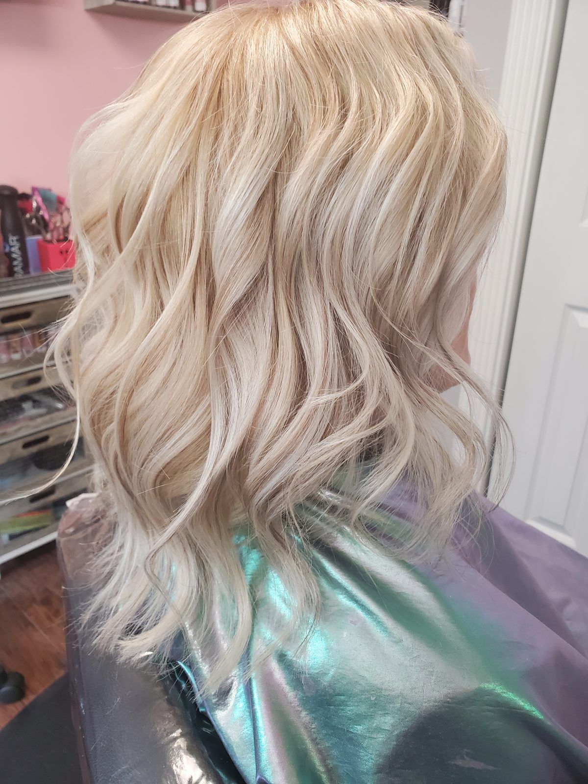 Bright, cool blonde beach waves, shown from the side.