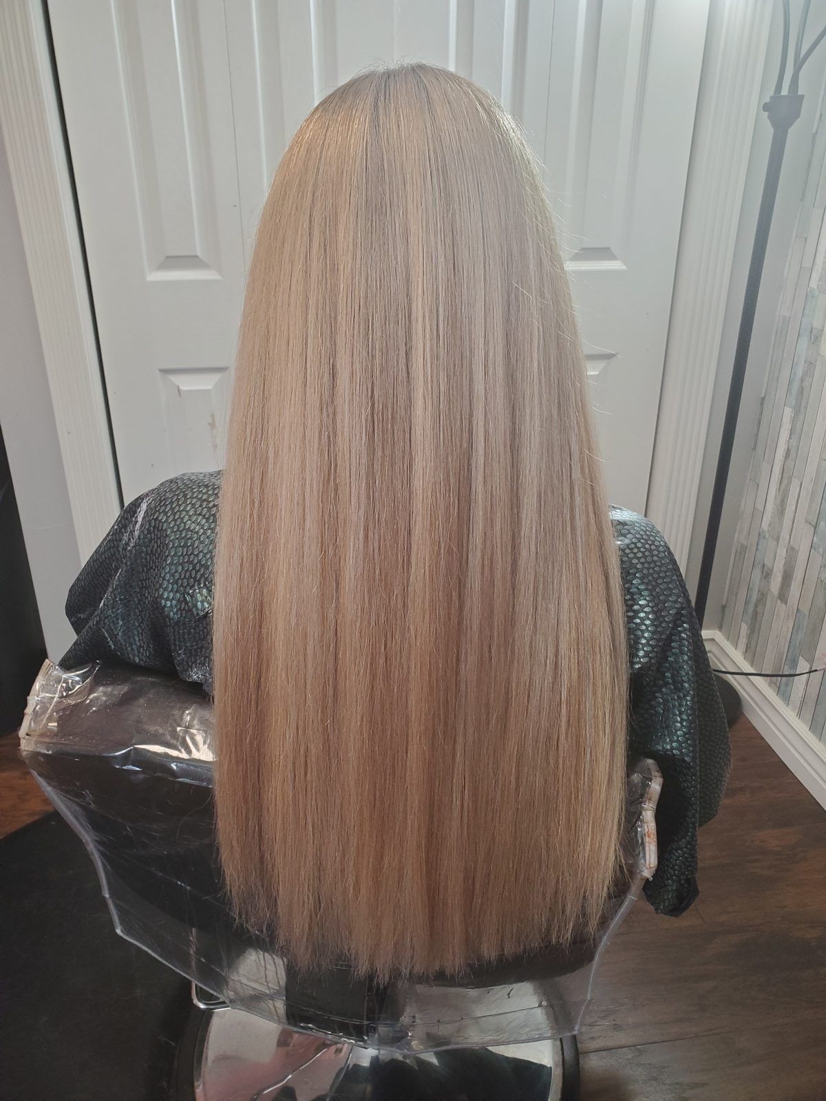 Long, sleek golden-beige blonde hair, shown from behind.