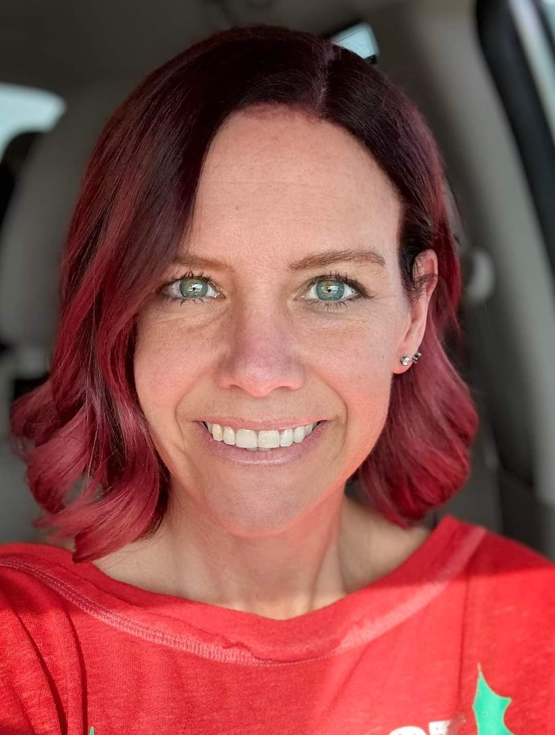 Deep cherry-red wavy bob, front view.